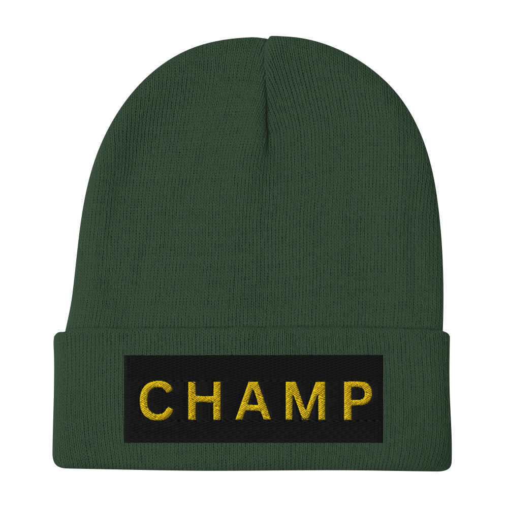 The Bold & brave CHAMP Embroidered Beanie is a green knit accessory featuring a folded brim and a black patch with CHAMP embroidered in bold yellow letters. The Bold & brave CHAMP Embroidered Beanie is a green knit accessory featuring a folded brim and a black patch with CHAMP embroidered in bold yellow letters.