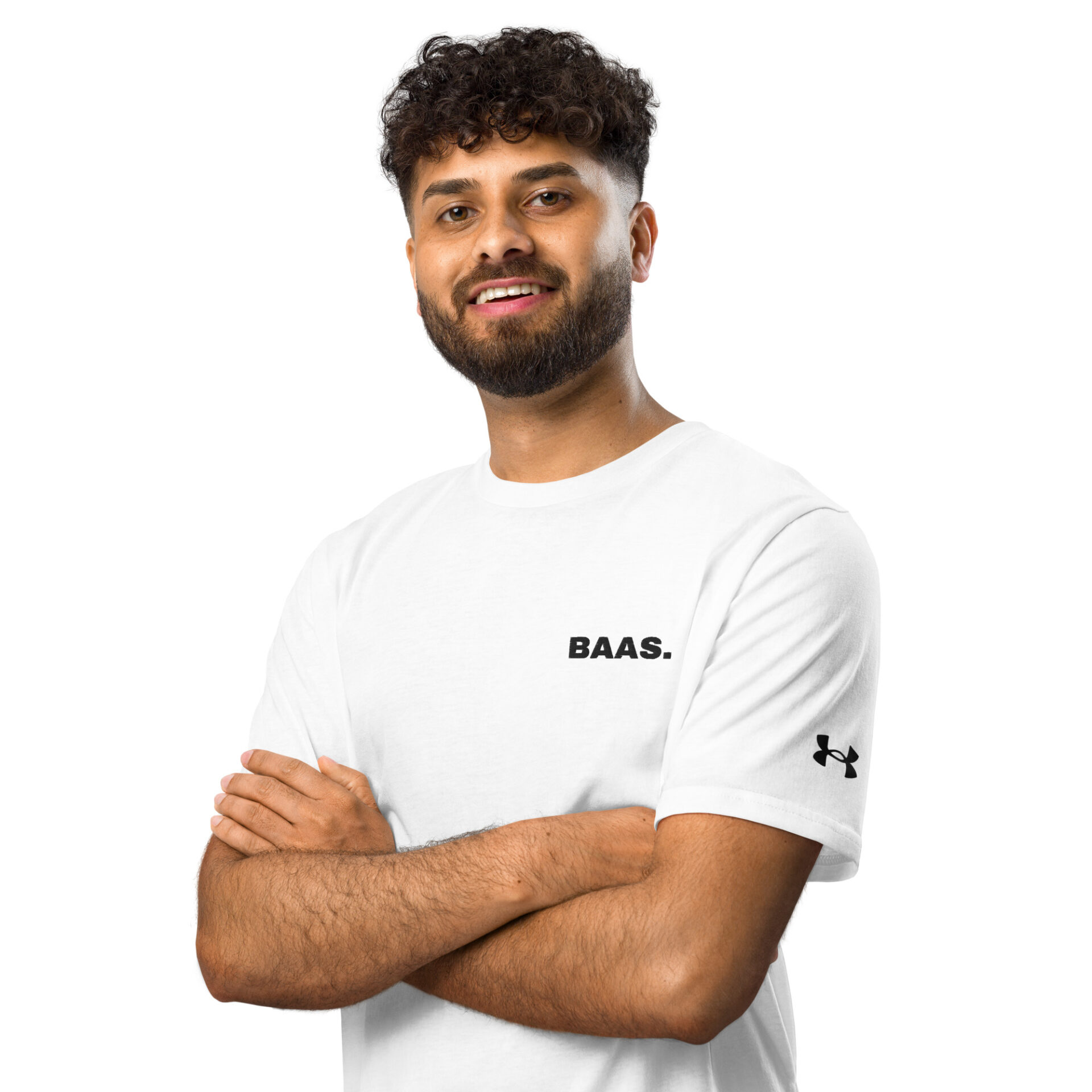 A curly-haired, bearded man smiles with his arms crossed, wearing a white Under ArmourⓇ athletic t-shirt with BAAS. on the chest and the brands logo on the sleeve, standing against a white background. A curly-haired, bearded man smiles with his arms crossed, wearing a white Under ArmourⓇ athletic t-shirt with BAAS. on the chest and the brands logo on the sleeve, standing against a white background.