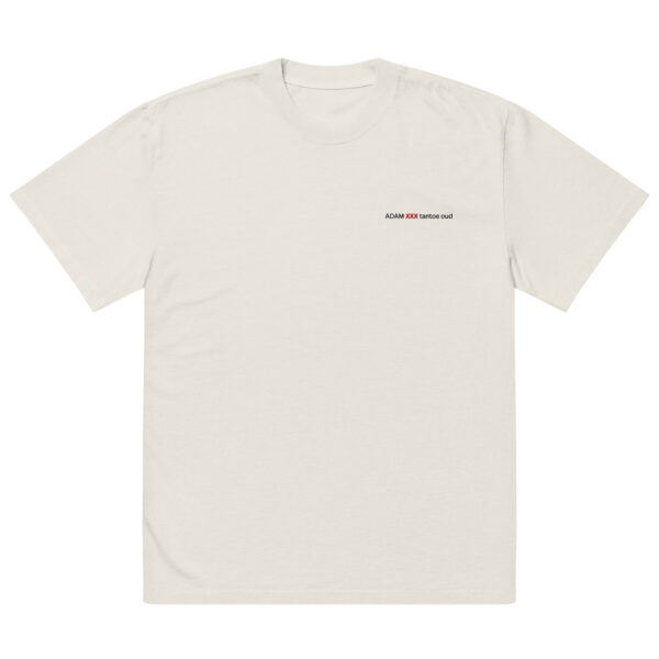 The Oversized faded t-shirt is a plain, light beige top with subtle fading and small black ADAM XXX tastes oud text on the left chest. It features an oversized fit and a minimalistic design with no extra graphics or patterns.
