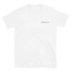The Short-Sleeve Unisex T-Shirt has a plain white design with small black text, ADAM XXX tattoo out, on the left chest. Shown laid flat on a white background.