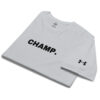 A folded white Under ArmourⓇ athletic t-shirt with "CHAMP." boldly printed on the front and the Under Armour logo embroidered on the sleeve. A folded white Under ArmourⓇ athletic t-shirt with "CHAMP." boldly printed on the front and the Under Armour logo embroidered on the sleeve.