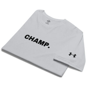 A folded white Under ArmourⓇ athletic t-shirt with "CHAMP." boldly printed on the front and the Under Armour logo embroidered on the sleeve.
